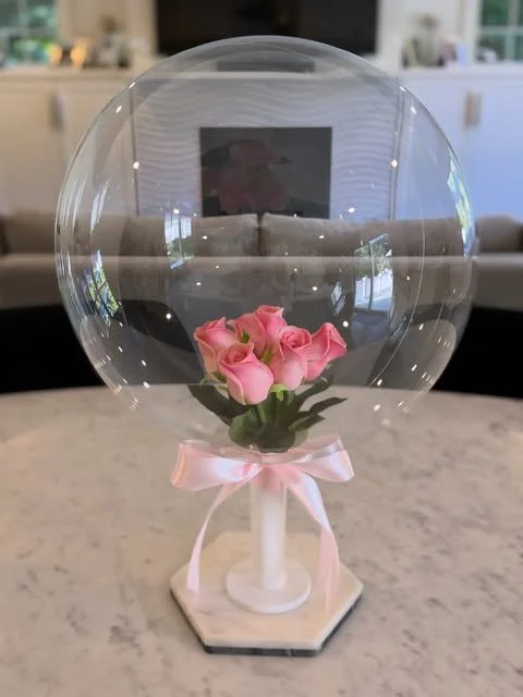 Clear bubble balloon with pink roses