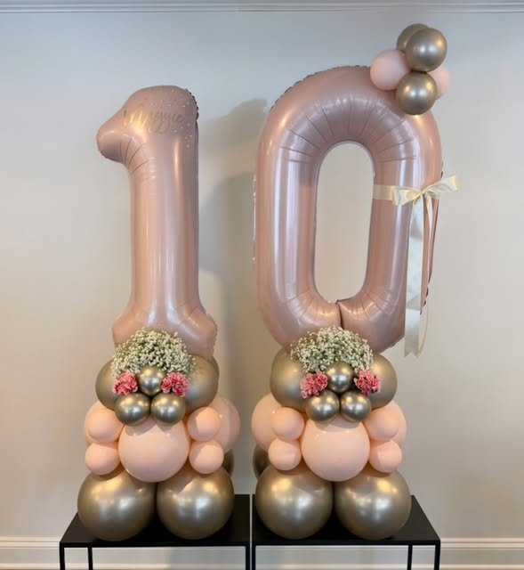 Number 10 balloon stacks in blush and gold