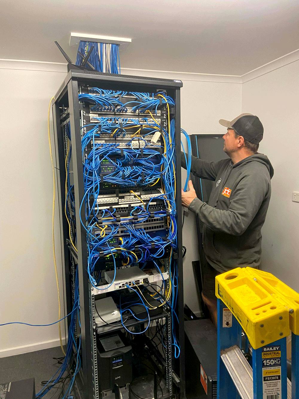 Clint from JCT Services making sure that critical IT equipment is powered safely and appropriately, keeping this business running and protecting their reliability