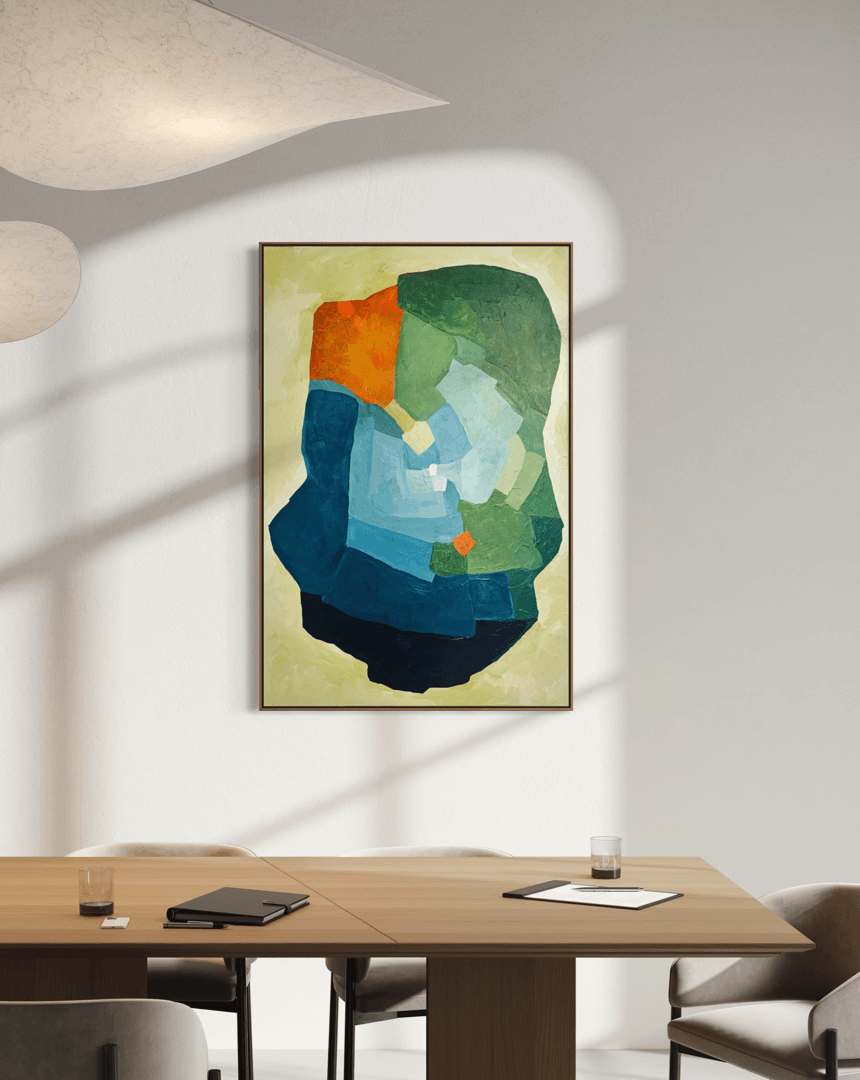 Balancing Friction – original, abstract artwork by Birgit Trofer. Contemporary artwork exploring the dynamic tension in blue, green and vibrant orange accents, mounted on an office wall.