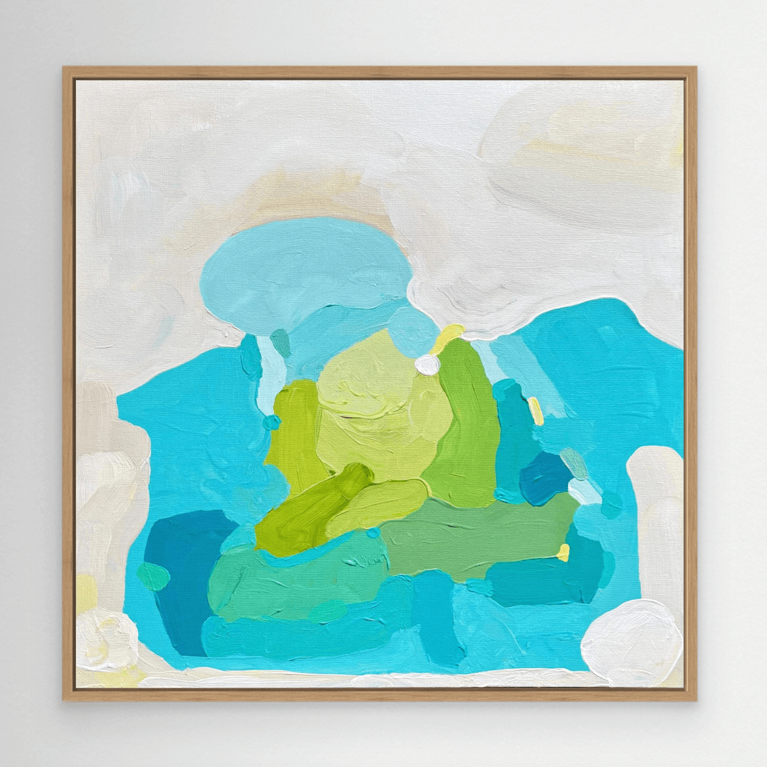 Coastal fine art print on canvas in oak floating frame by Birgit Trofer, mounted on wall.