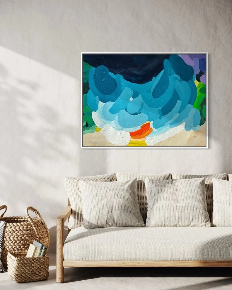 Contemporary canvas print Luminous Tide by Austrian artist Birgit Trofer. Front view of the abstract seascape hanging beautifully above a sofa in warm, natural light.