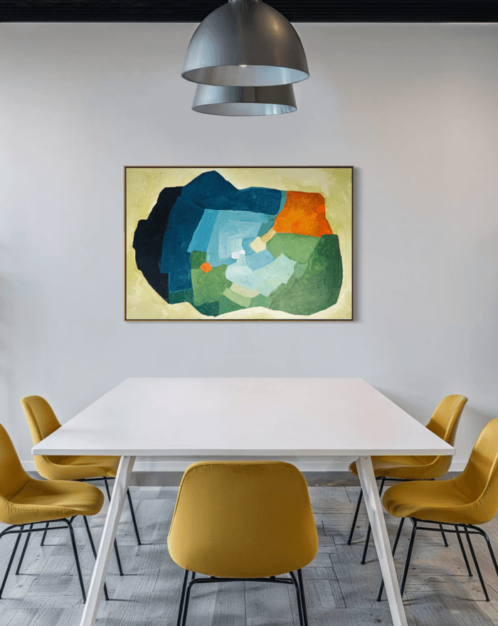 Balancing Friction – original, abstract artwork by Birgit Trofer. Contemporary artwork exploring the dynamic tension in blue, green and vibrant orange accents, in a contemporary meeting room of an office.
