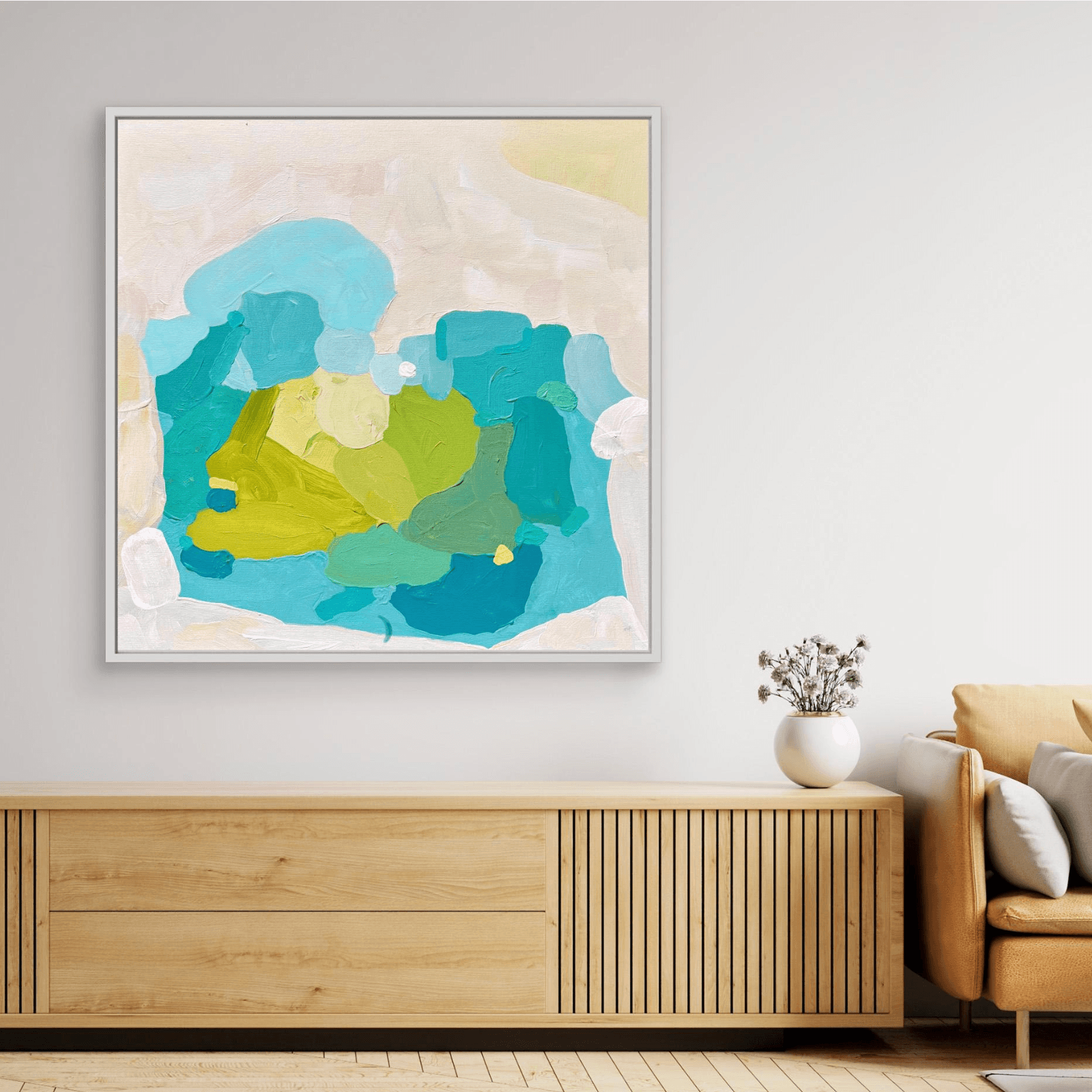 Contemporary artwork Aquamarine Muse by Birgit Trofer in white floating frame styled in living room above wooden shelf.