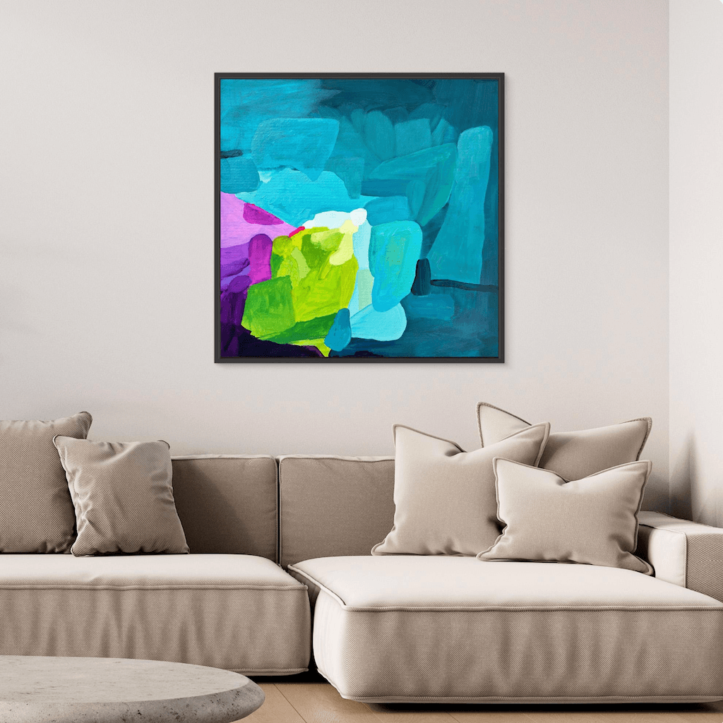 Quiet luxury home decor featuring the modern art print Deep Swell by Birgit Trofer in a black frame, beautifully placing vibrant blue and contrasting colors in a bright, relaxing living space.