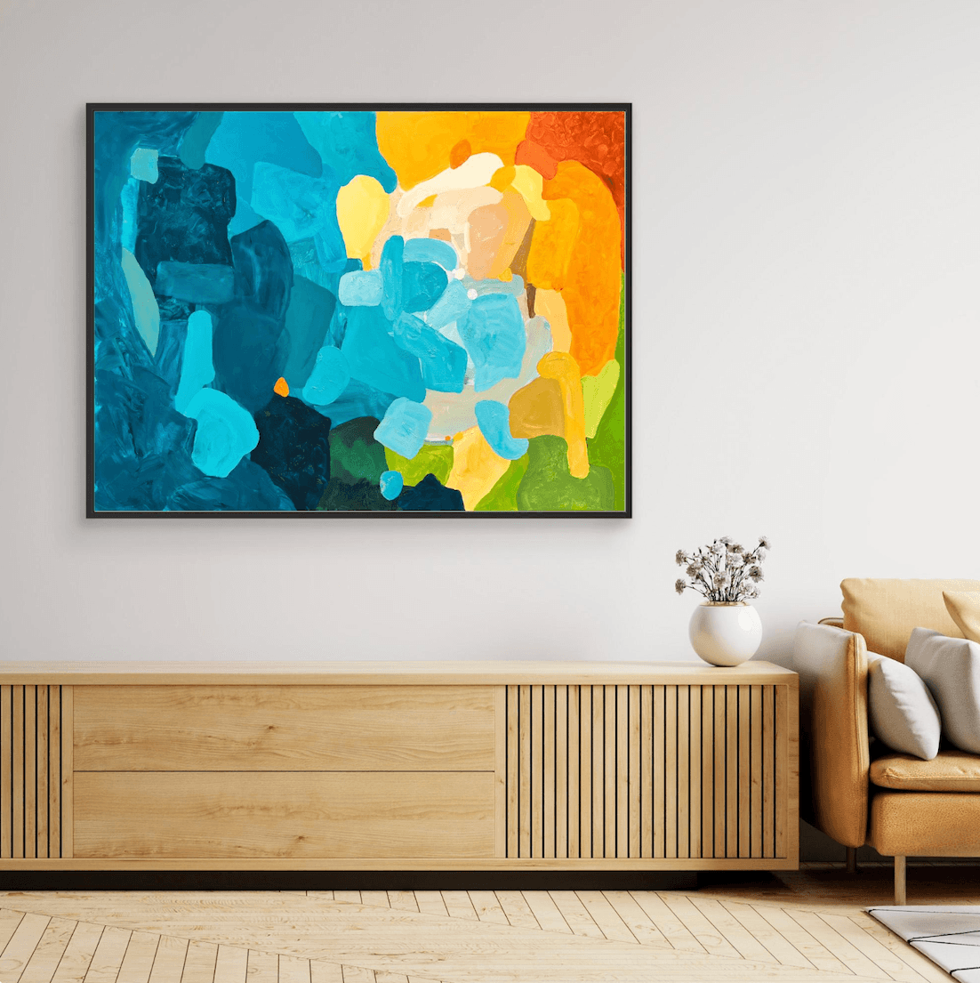 Quiet luxury home decor featuring the modern art print Sunset Flow by Birgit Trofer in a black frame, beautifully placed above an oak console in a bright interior.