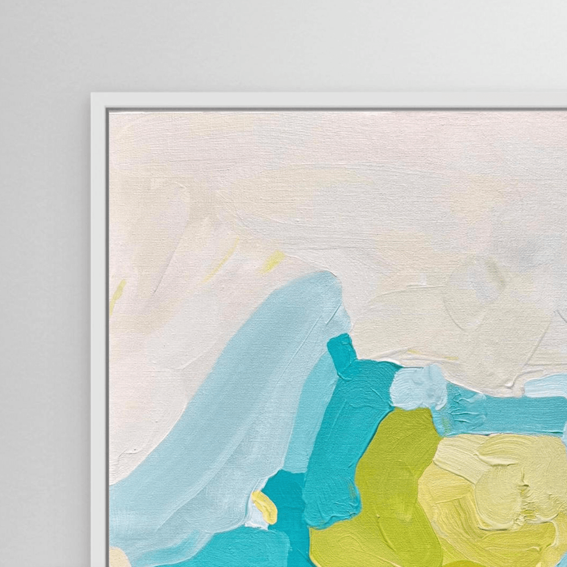 Close-up of coastal fine art print on canvas in white floating frame by Birgit Trofer.