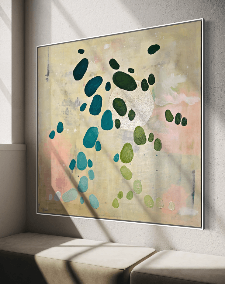 Painting by Birgit Trofer mounted above a bench beside a window with beautiful sunlight allowing to experience the different nuances of hues of the painting from the series Dancing Palette.