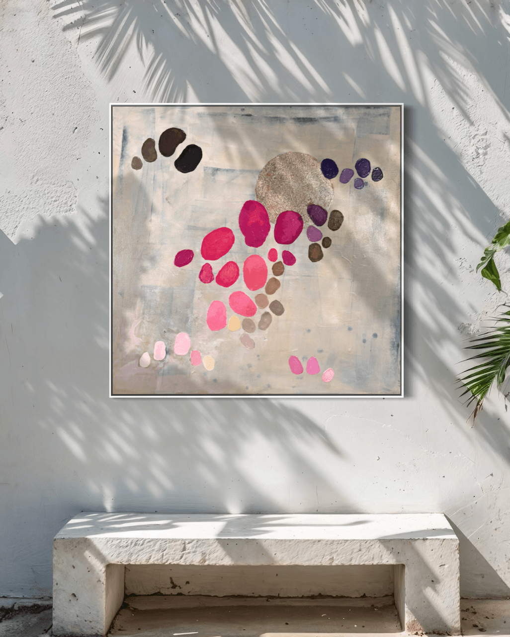Painting by Birgit Trofer from the series Dancing Palette mounted on a concrete wall, in a white shadow gap frame.