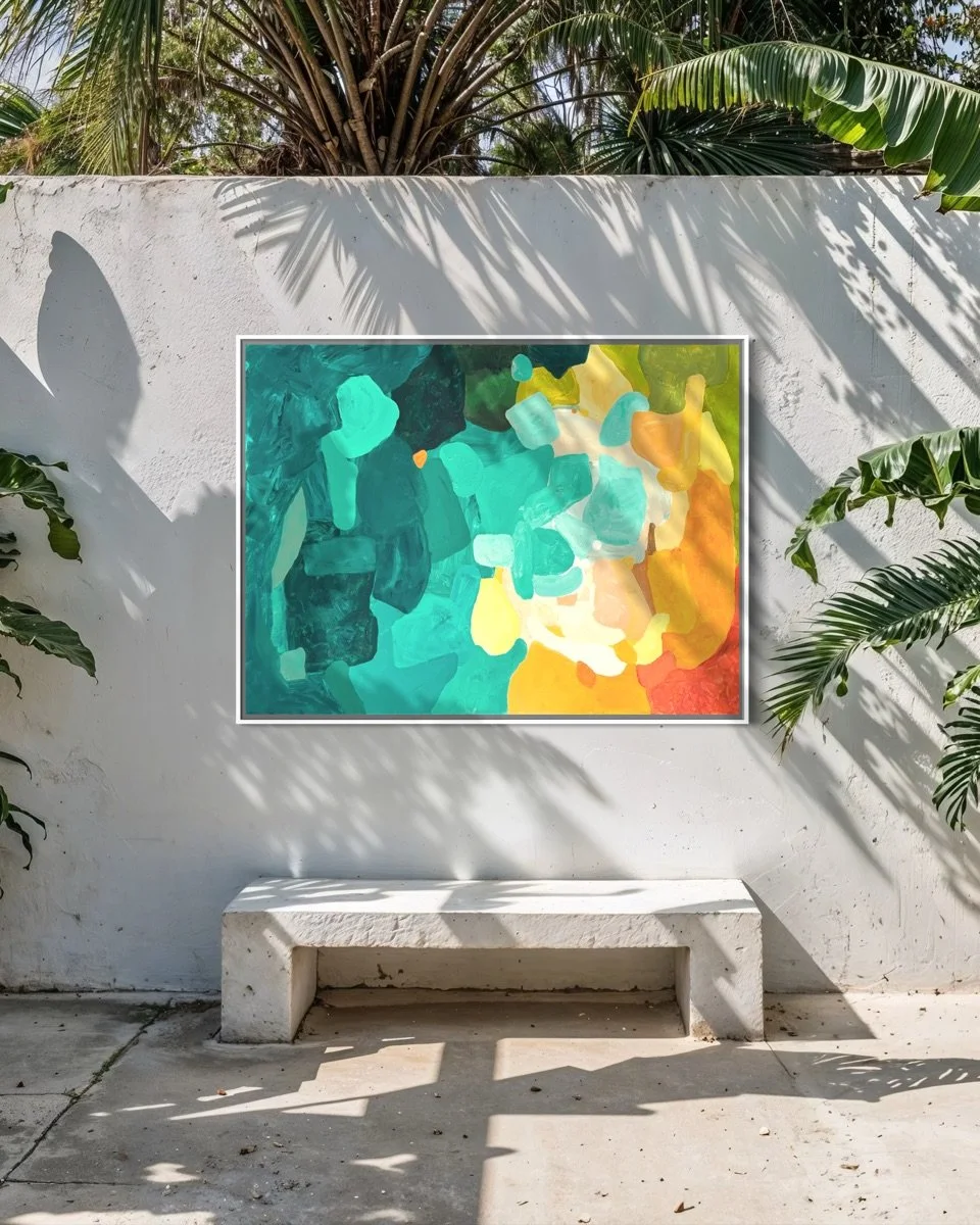 Vibrant fine art canvas print Amber Perspective by Birgit Trofer hanging on a modern concrete wall outdoors, surrounded by palm trees and natural sunlight shadows.