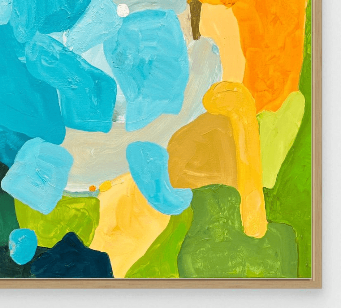 Macro view of fine art edition Sunset Flow by Austrian artist Birgit Trofer, showing the luminous color layers and the elegant shadow gap of the natural oak frame.