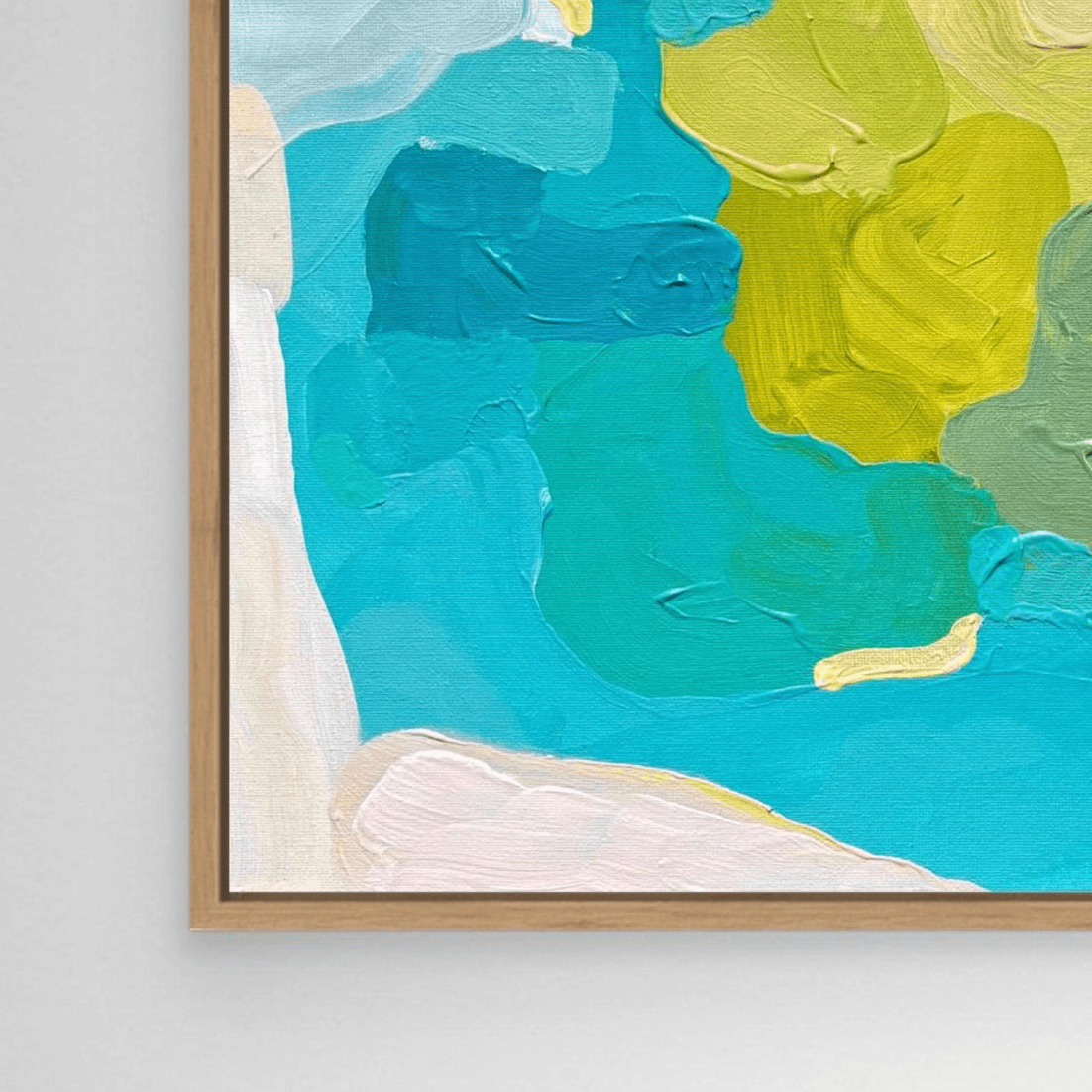 Close-up of coastal inspired painting by Birgit Trofer in wooden floating frame, vibrant colors in blue, turquoise, aqua and shades of green.