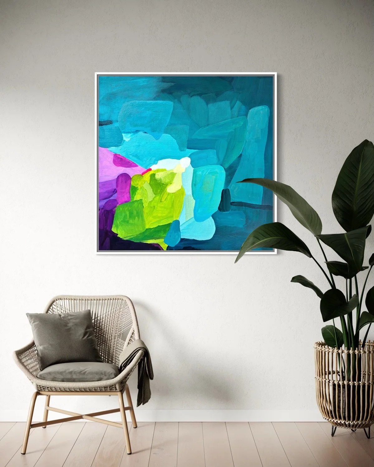 Abstract artwort "deep swell" by Austrian artist Birgit Trofer in a white floating frame, a contemporary seating are, beside a plant.