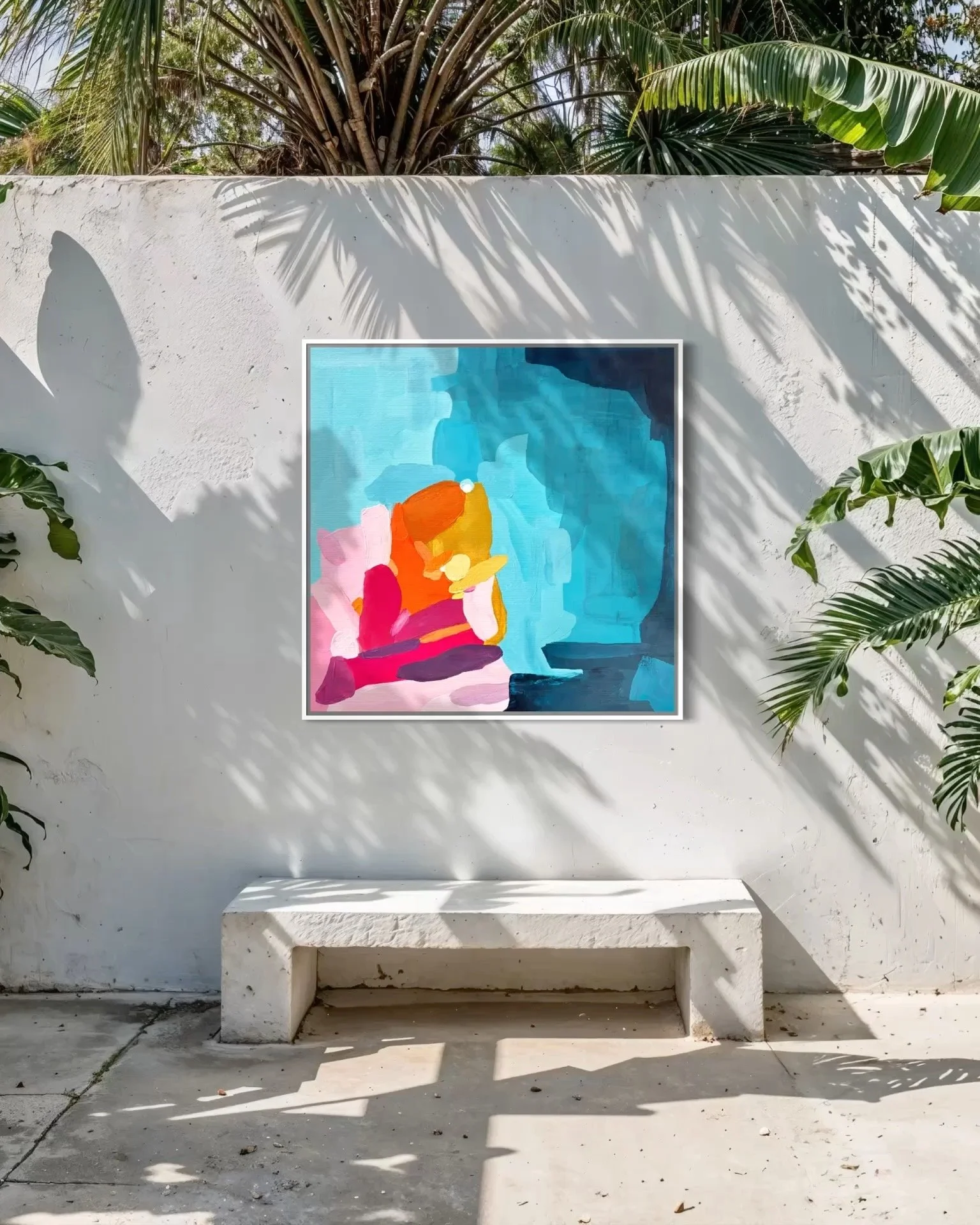 Abstract blue canvas art Sun-drenched Ambition by Birgit Trofer styled on a modern concrete wall in a luxury Mediterranean garden.