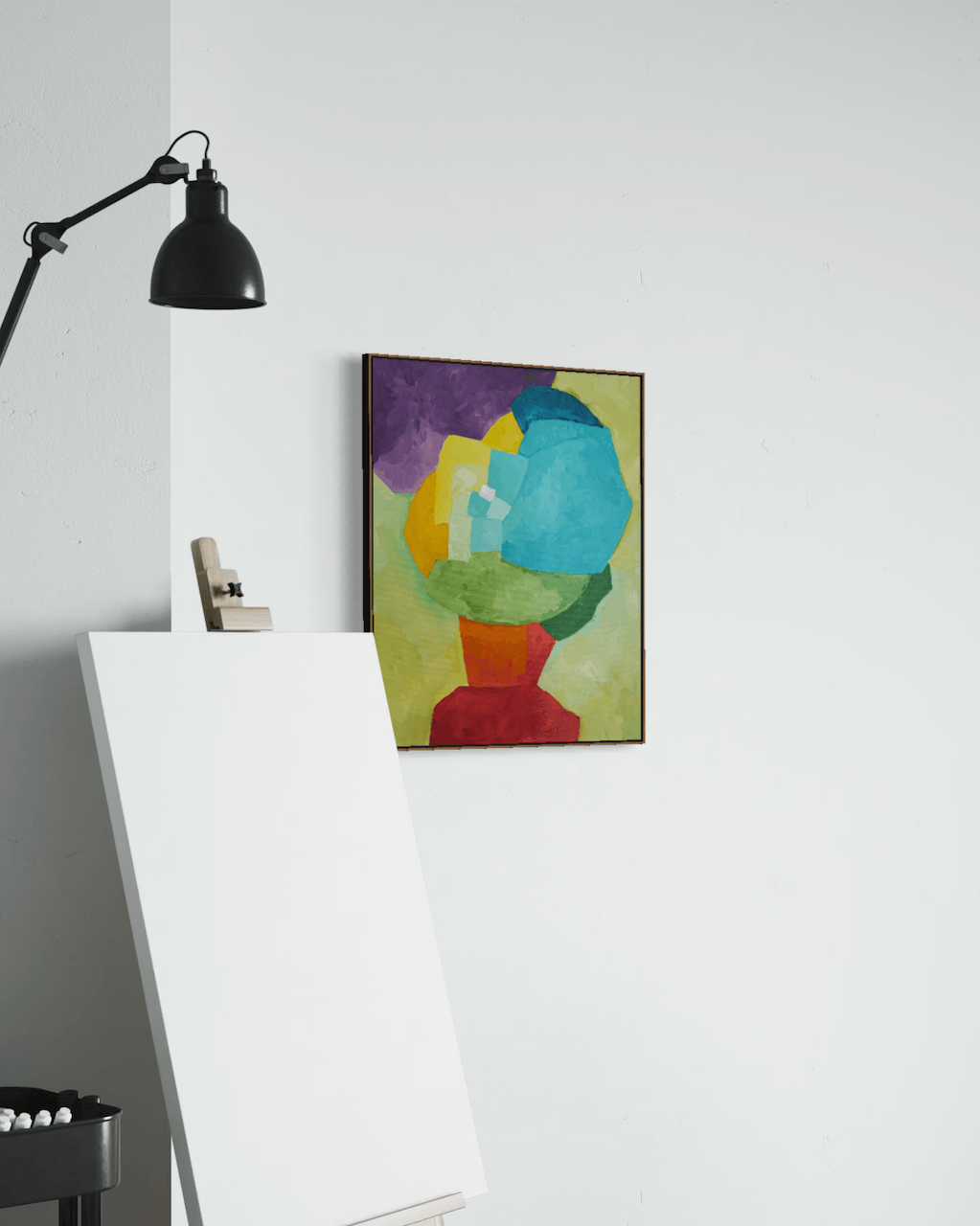 Original abstract painting Constructing Balance by Birgit Trofer, in the studio beside an easel.
