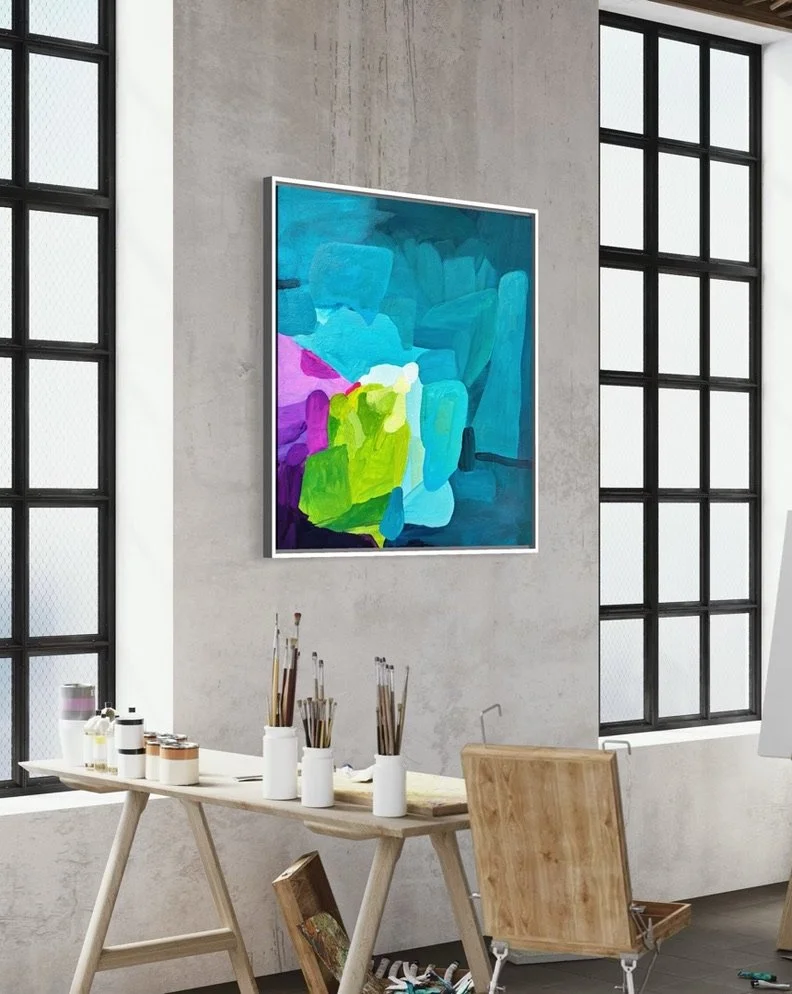 Studio view of painting the abstract artwork from the series the balearic shift by Birgit Trofer, with brushes and paint on a table in front of the painting mounted on the studio wall in a loft.
