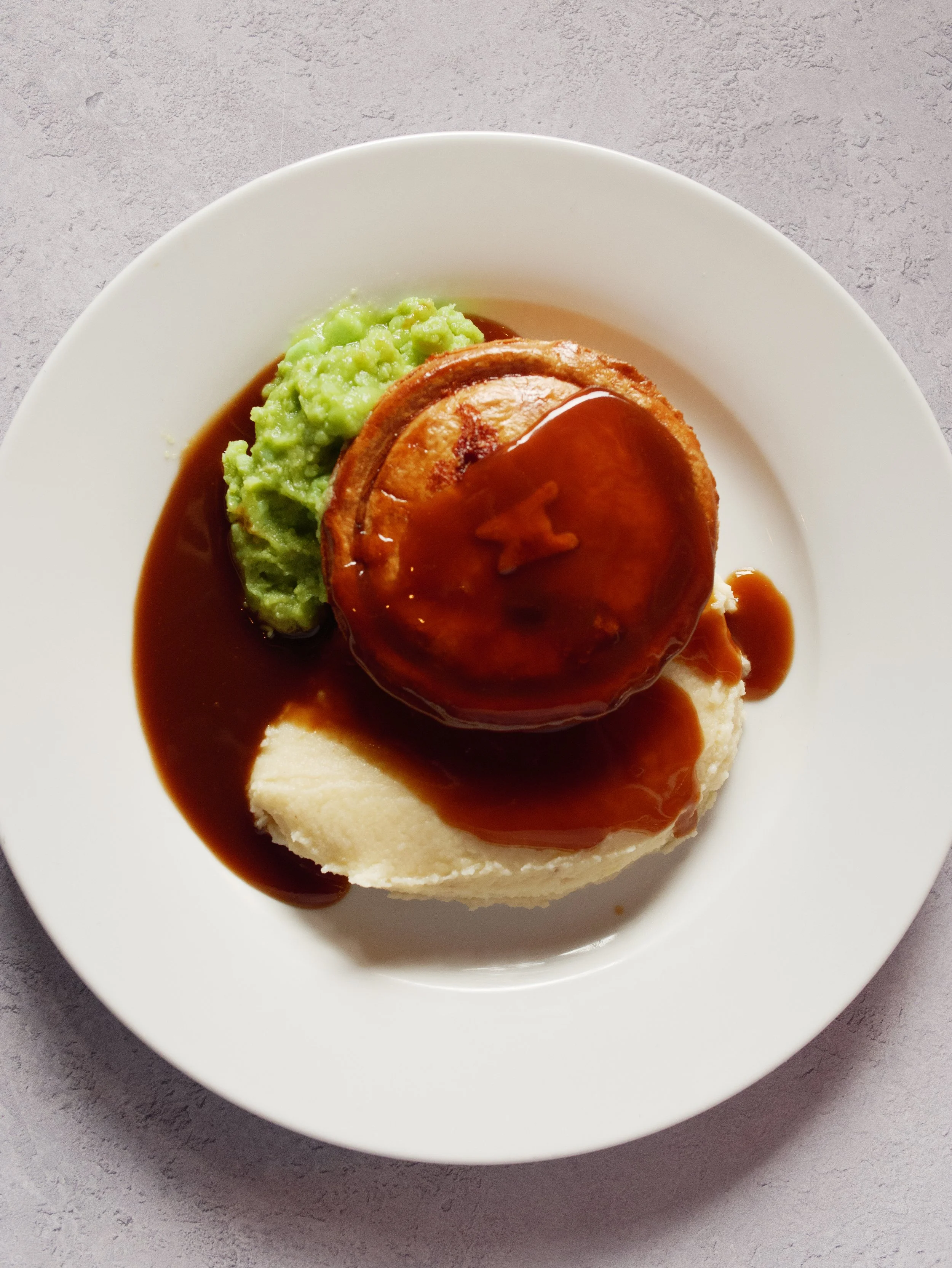 The perfect relaxed wedding breakfast; pie, mash, mushy peas and gravy.