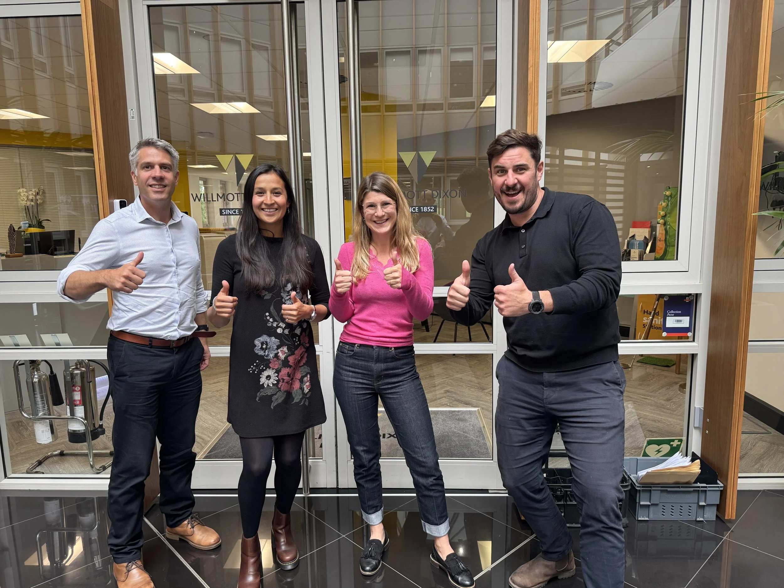 Photo of the Wilmott Dixon team with their thumbs up