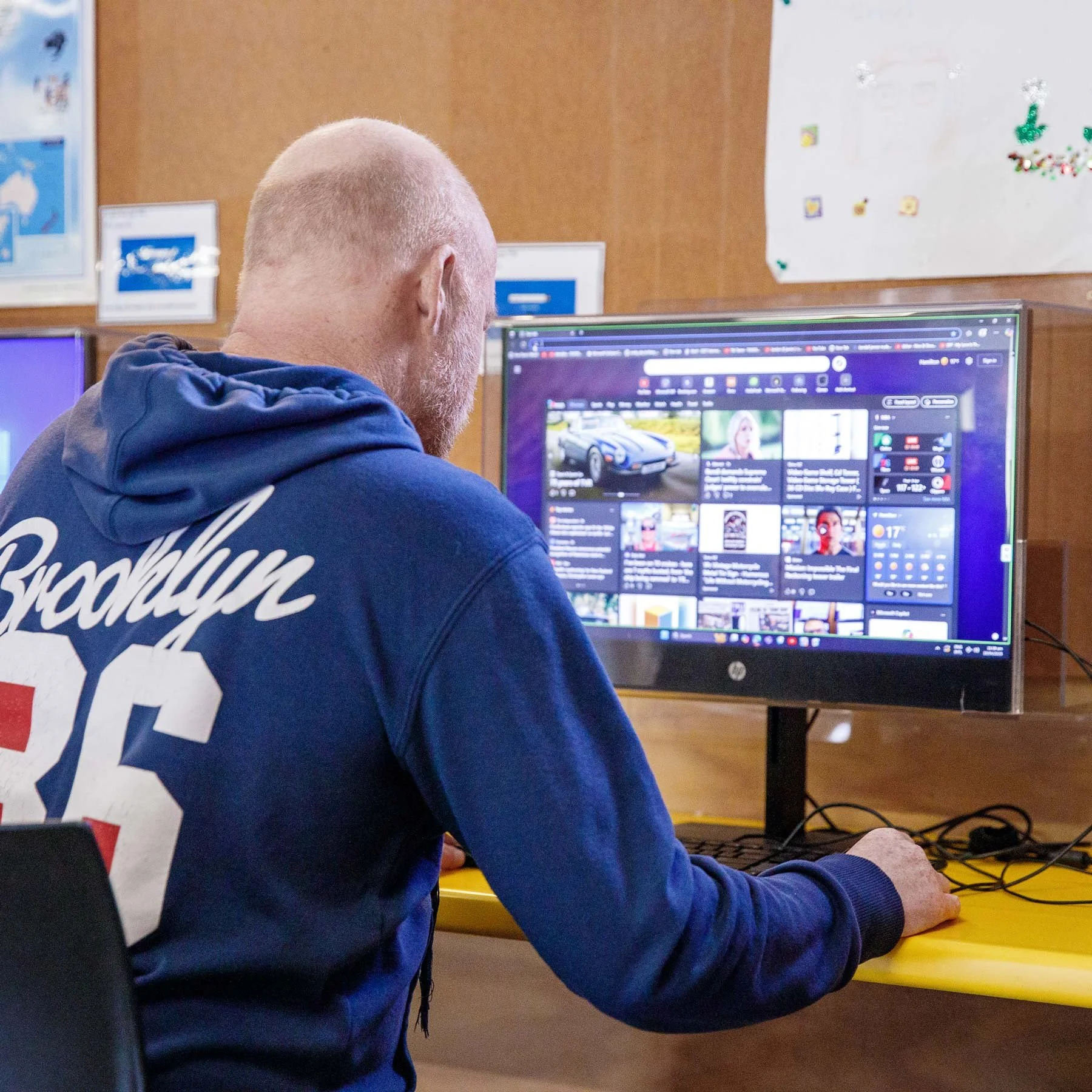 Solway Vision resident using computer