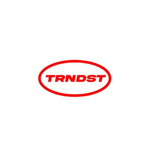 Red logo with the word 'TRN DST' inside an oval shape.