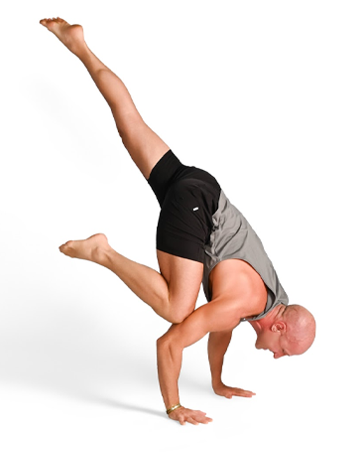 A bald man performing a handstand balancing on his hands with one leg raised and the other bent, on a plain white background.