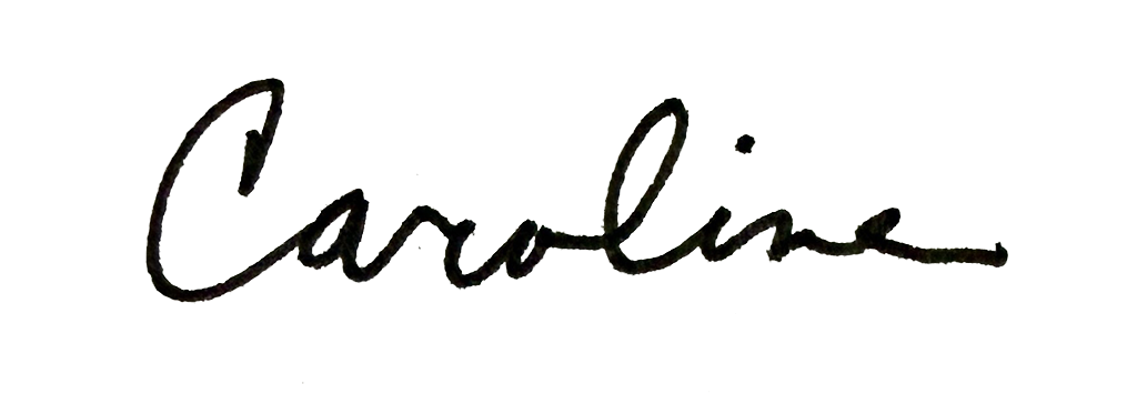 Close-up of the word "Carolina" written in black cursive on a white background.