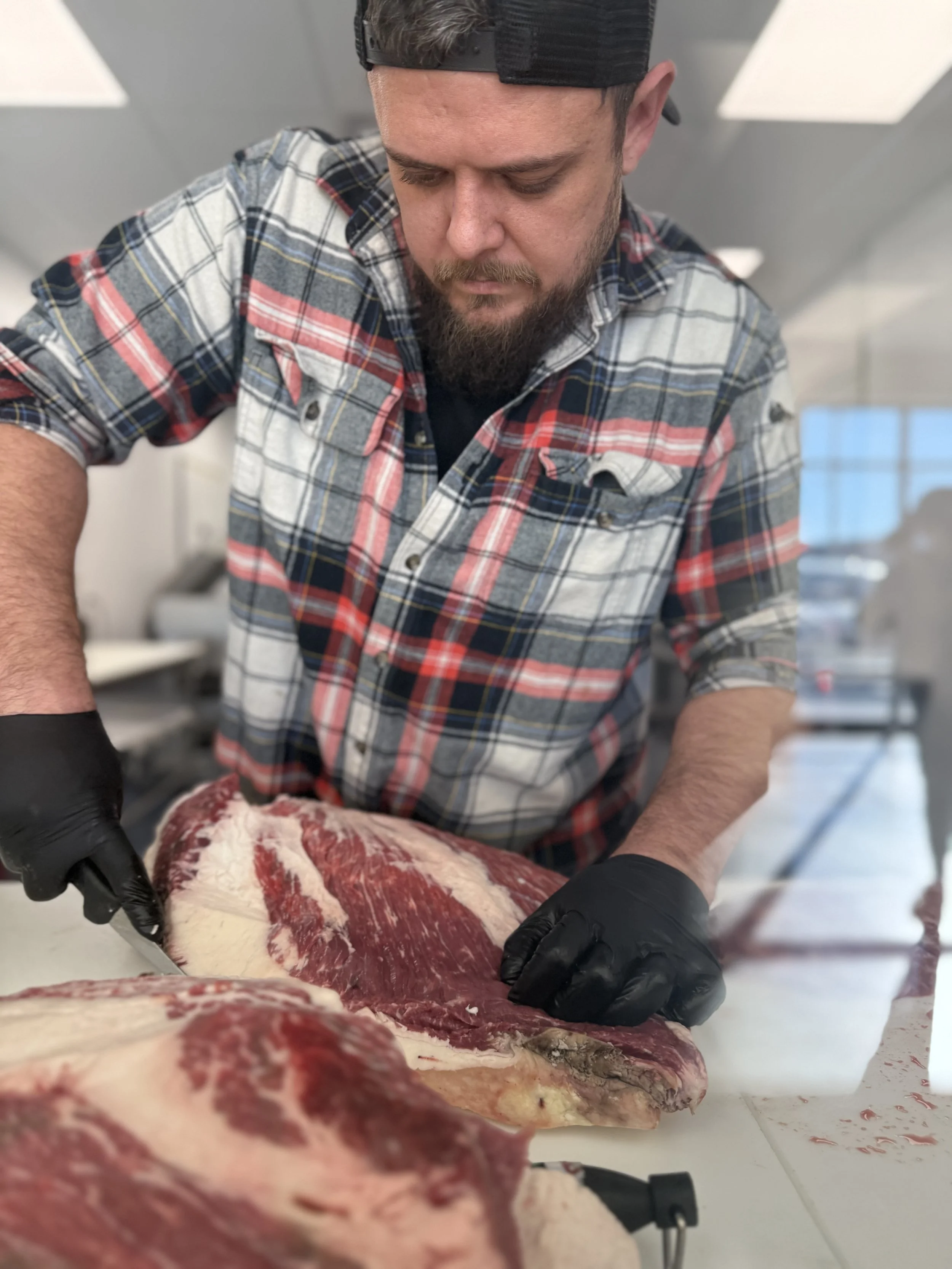 Butcher cutting local beef