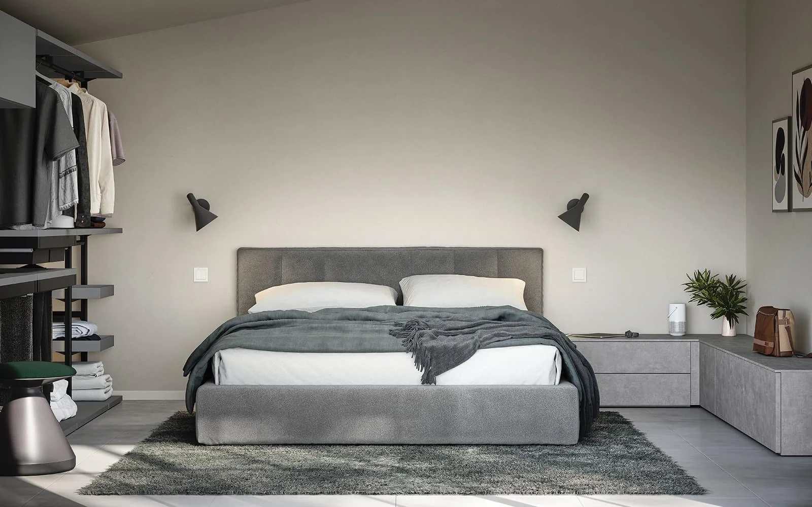 Modern bedroom with grey upholstered bed, white pillows, dark grey blanket, black wall-mounted lamps, grey built-in side table, green plant, framed art on wall, open closet with hanging clothes, grey rug, and grey flooring.