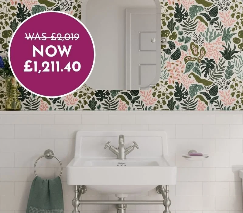 Bathroom with white tile wall, floral wallpaper, a white sink with silver fixtures, a mirror, and a purple sale sticker showing discounted price.