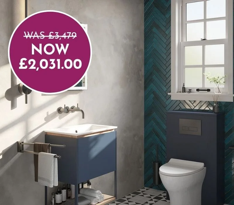 Modern bathroom with a blue vanity, white sink, grey walls, blue patterned accent wall, white toilet, and a window with a small plant on the window sill. A price tag overlay shows a discount from £3,479 to £2,031.