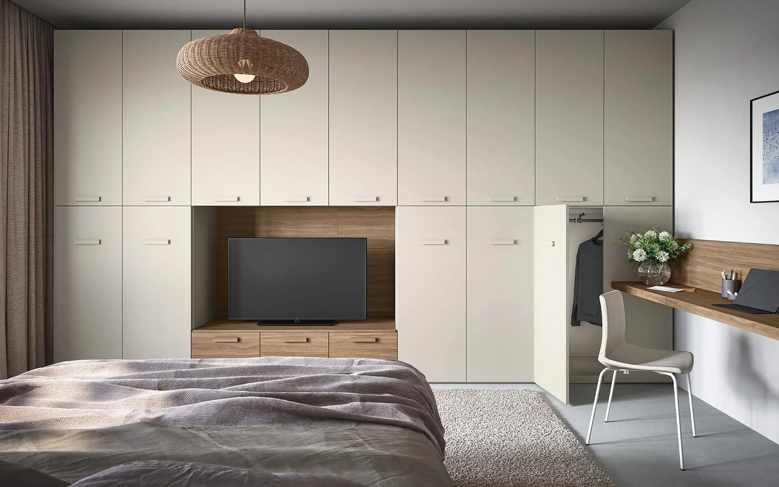 Modern bedroom with a bed, built-in white cabinets, a flat-screen TV in a wooden compartment, a small desk with a chair, a laptop, a vase with flowers, and a framed picture on the wall.