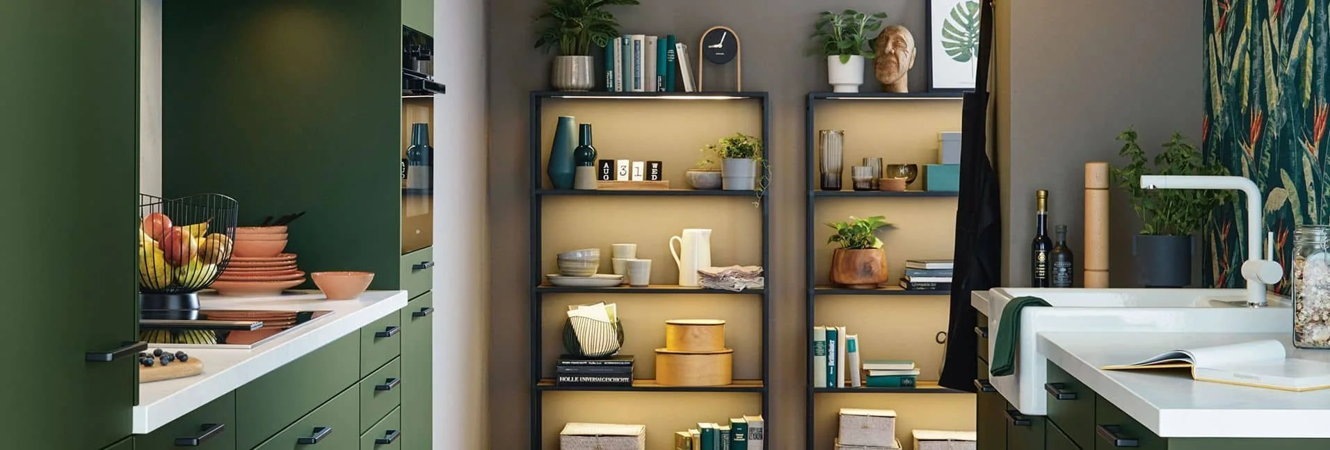 Modern shaker kitchen with green cabinets, open shelves with vases and dishes, decorative items, and potted plants. Refrigerator, fruit basket, and a white sink are also visible.