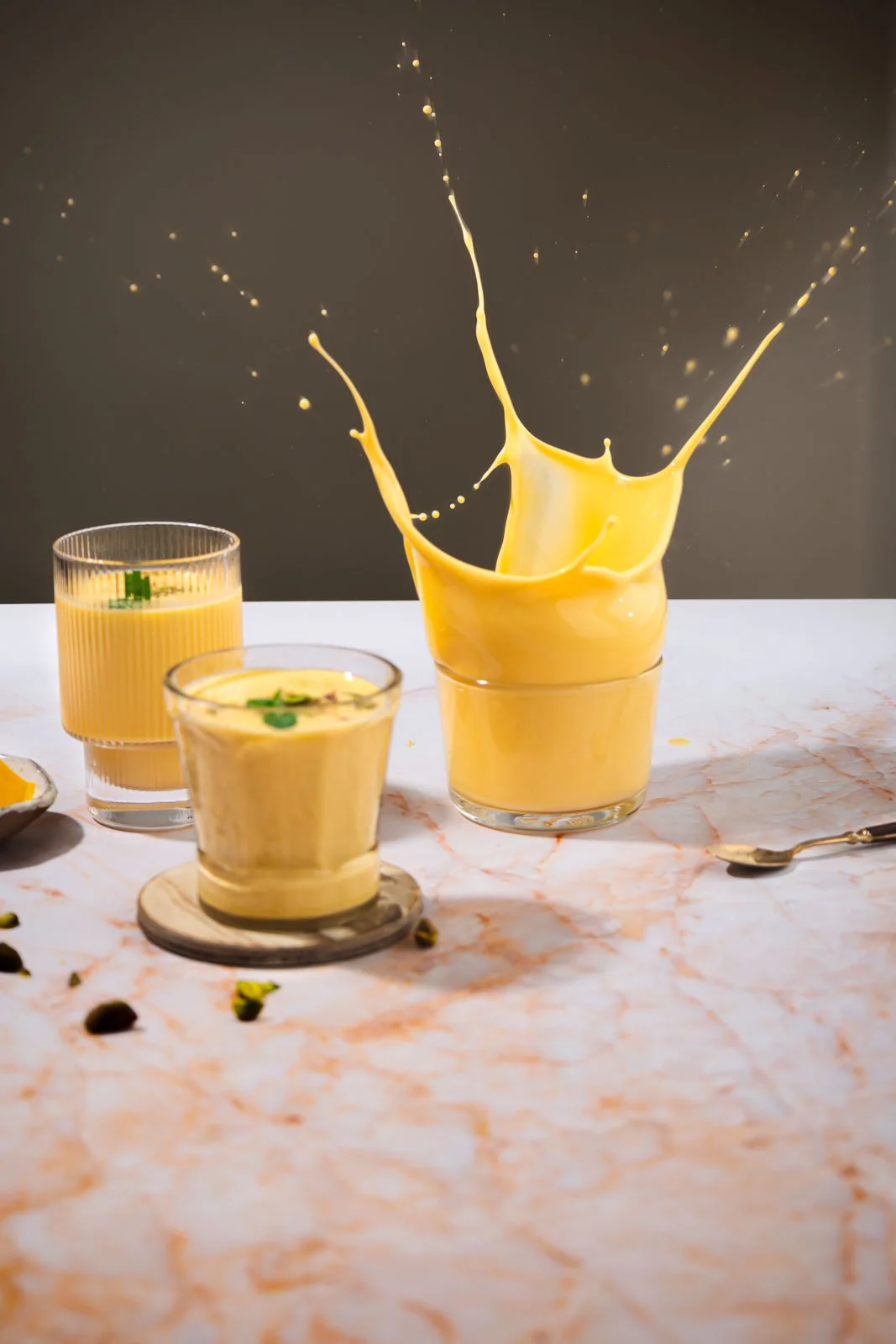 Drink captured mid-splash in a glass