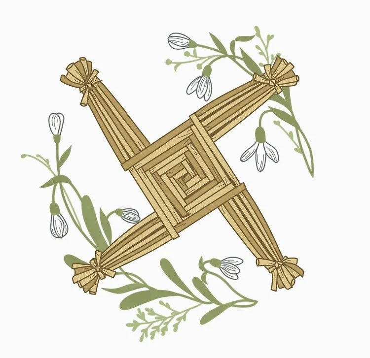 A woven Brigid’s cross made from straw or reeds, arranged in a symmetrical, four-armed design.