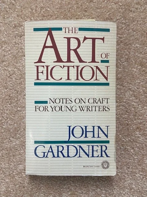 A book titled “The Art of Fiction: Notes on Craft for Young Writers” by John Gardner with a simple lined cover design
