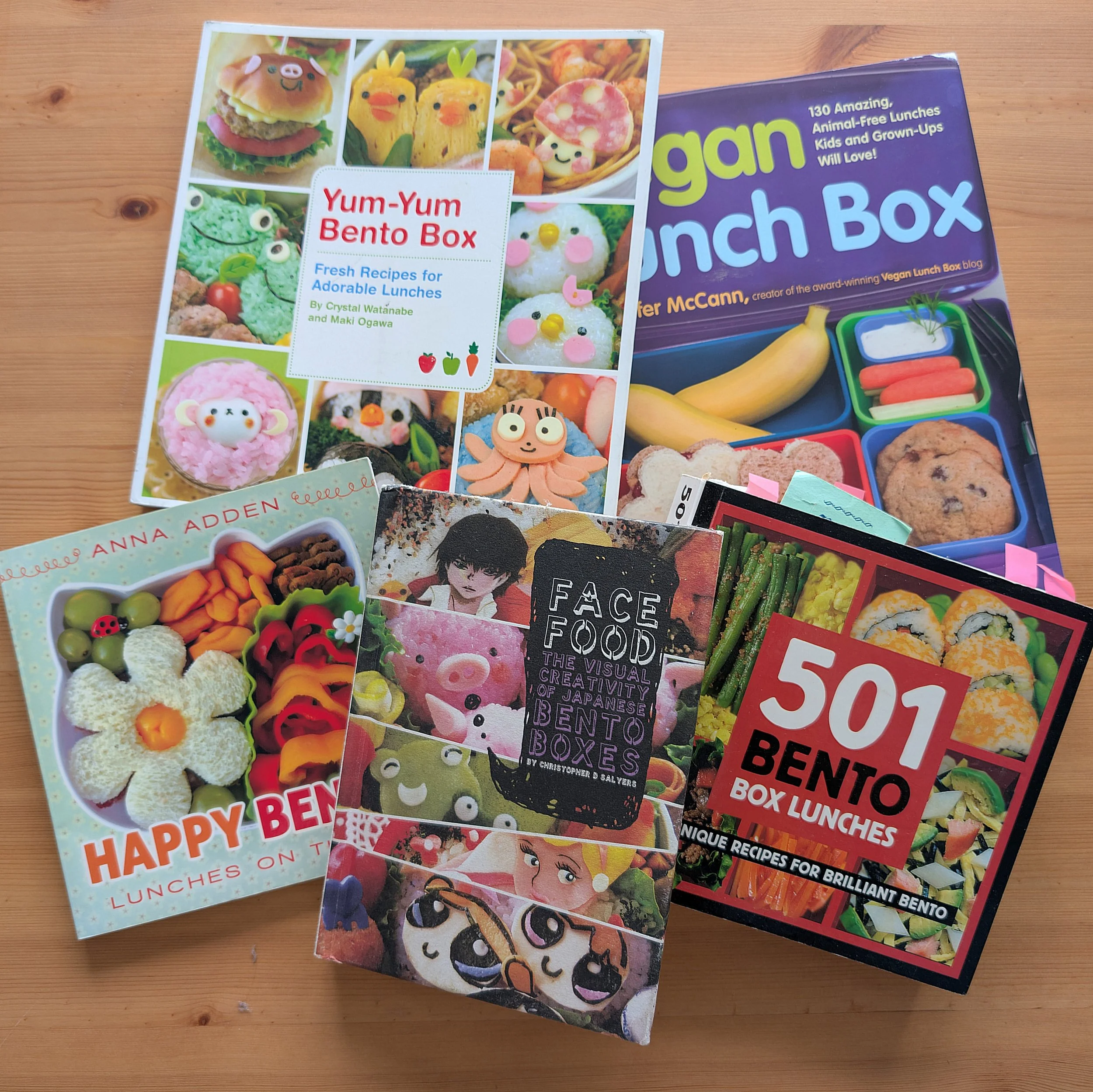 bento lunchbox books arranged on a wooden table