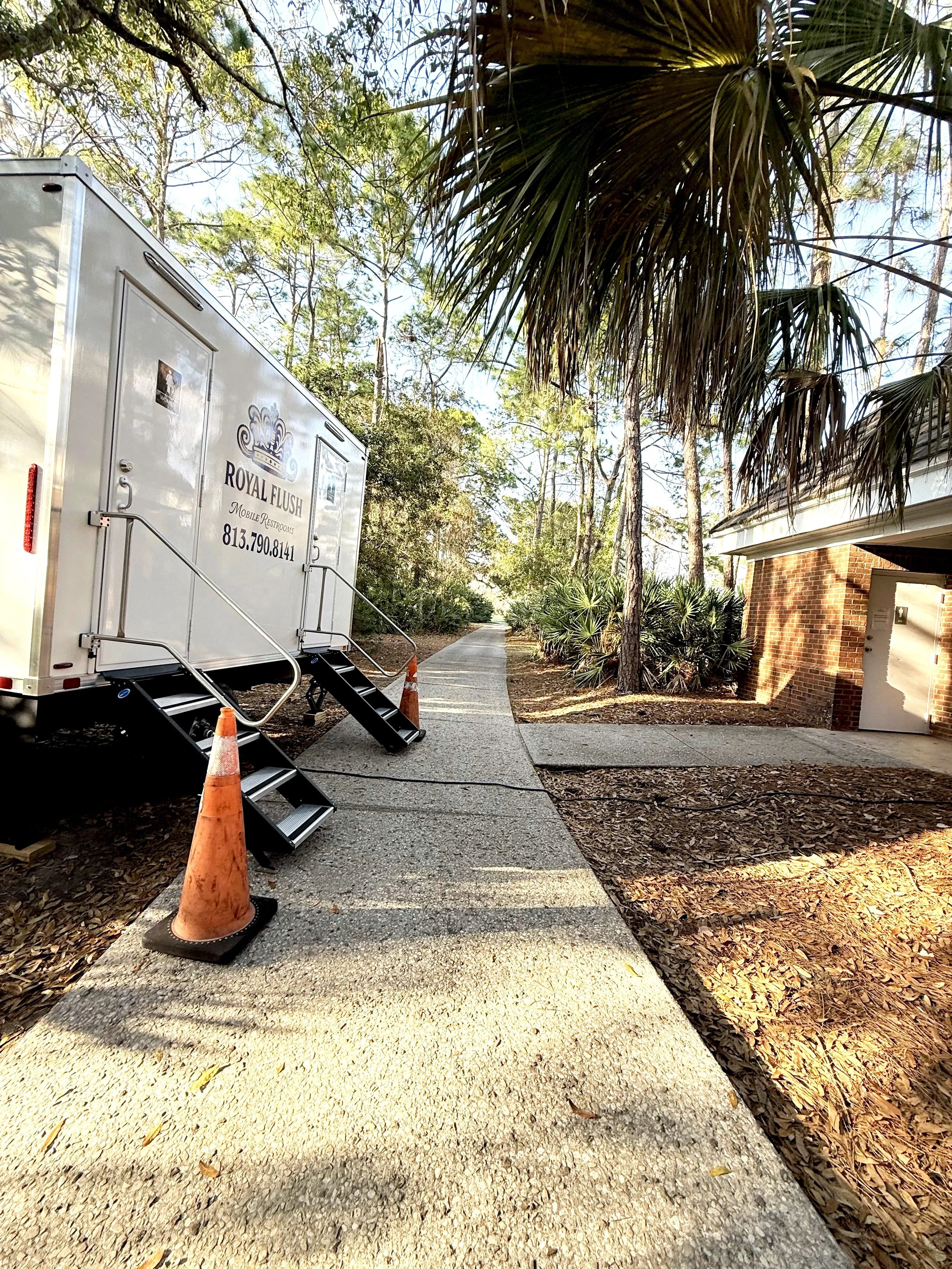 Climate controlled restroom trailer for emergency plumbing repairs for community golf course Tampa West Chase Florida. 