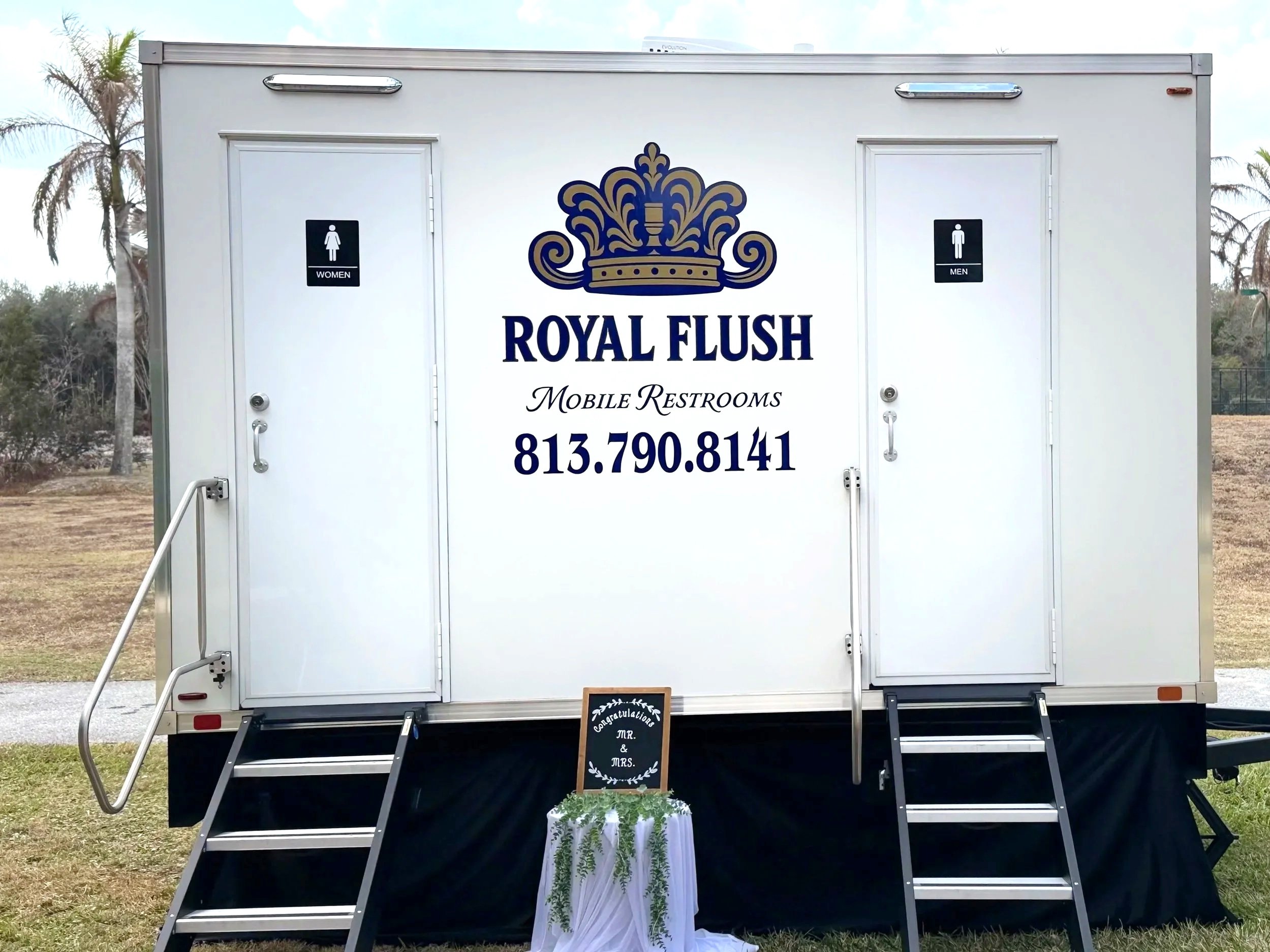 Climate controlled 4-station community Lang restroom trailer for outdoor Florida weddings in Palm City, Plant City, Brandon, Riverview, Sarasota, Hudson, Tampa and Lakeland 4.25.2026