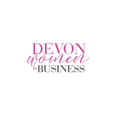 Logo for Devon Women in Business, with 'DEVON' in large pink letters, 'women' in cursive pink, and 'IN BUSINESS' in black capital letters.
