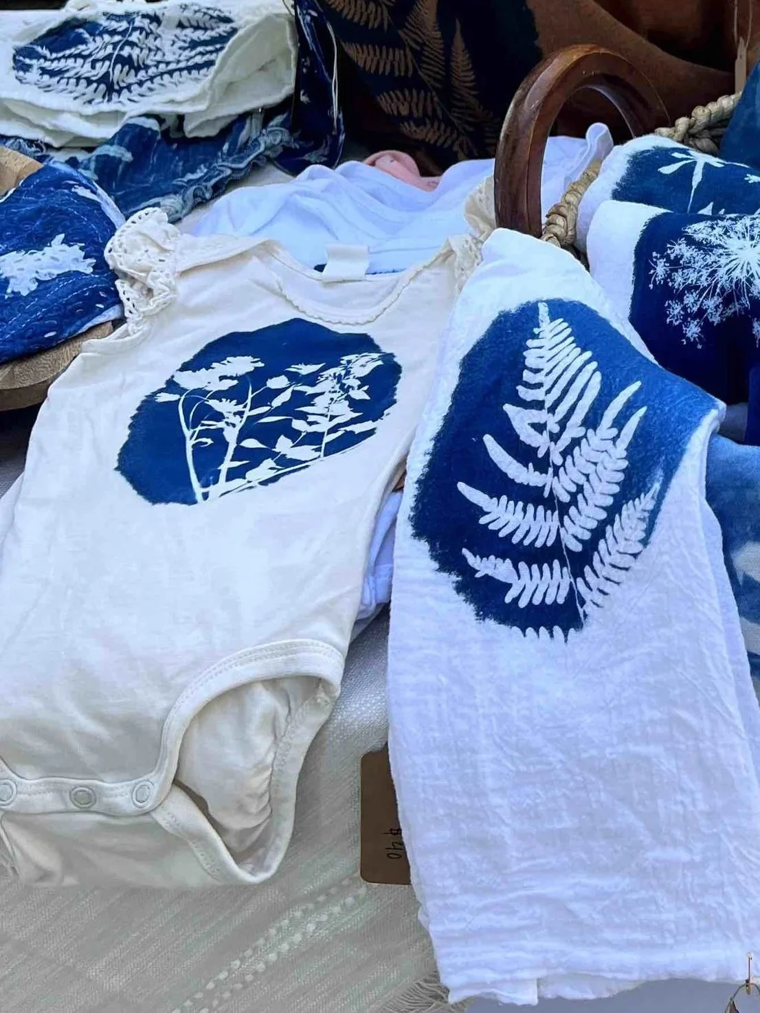 Short sleeve white onesie with blue cyanotype design