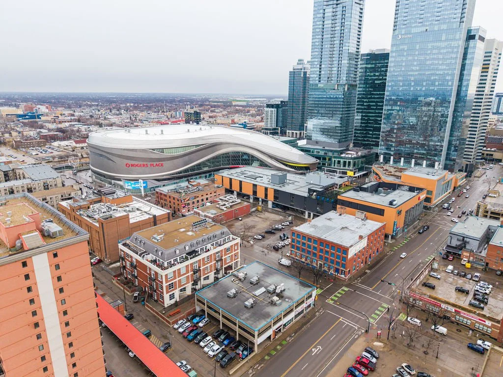 A cityscape view of downtown Nashville with prominent Rogers Place sports arena and surrounding high-rise buildings.