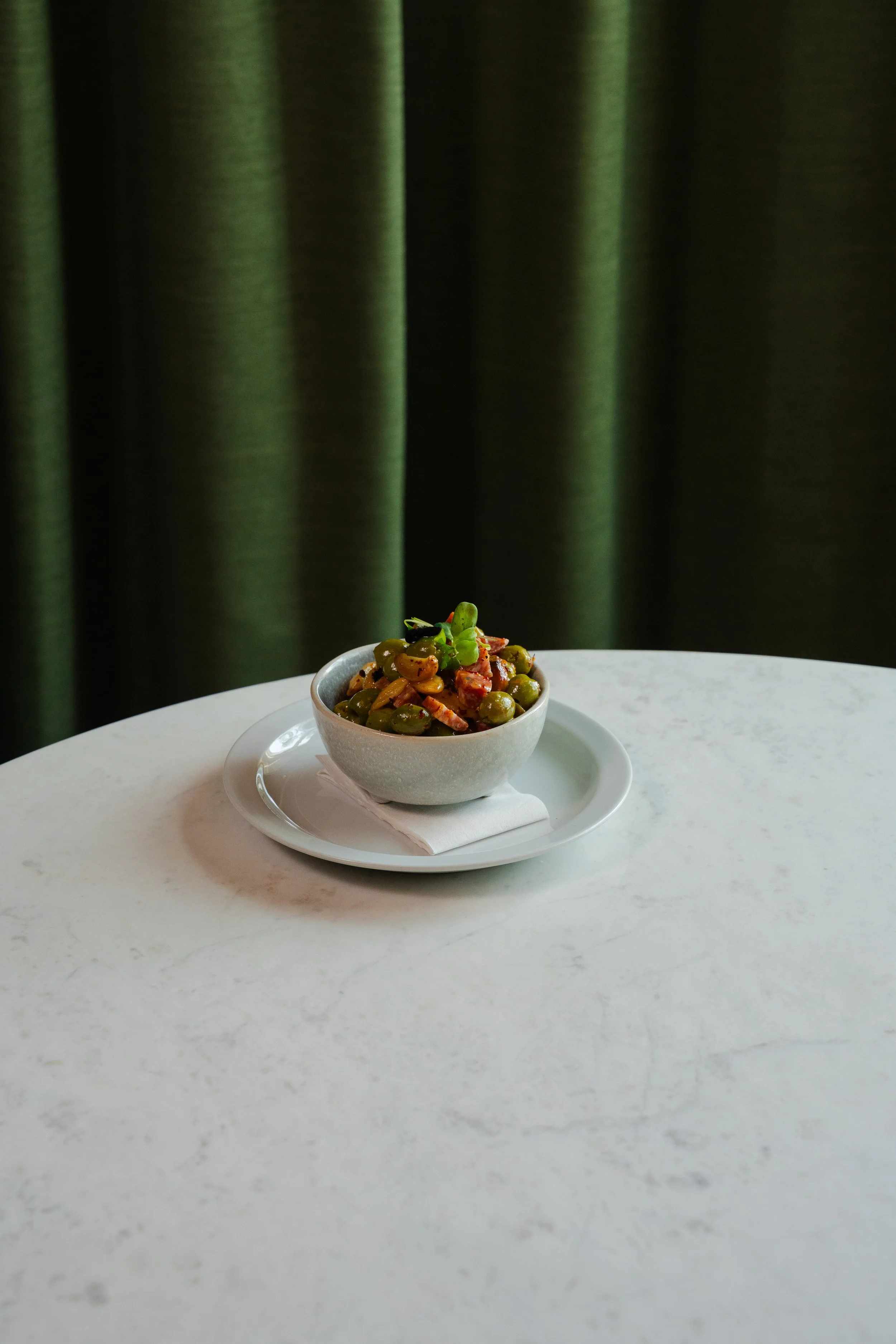 “Olivata”: Castelvetrano olive medley, soft salamino, roasted garlic-orange oil