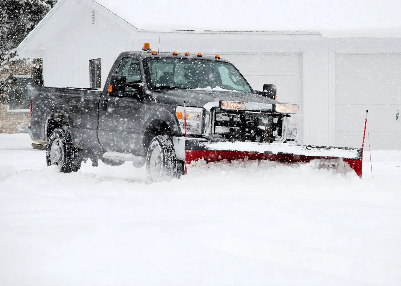 Truck plowing through snow