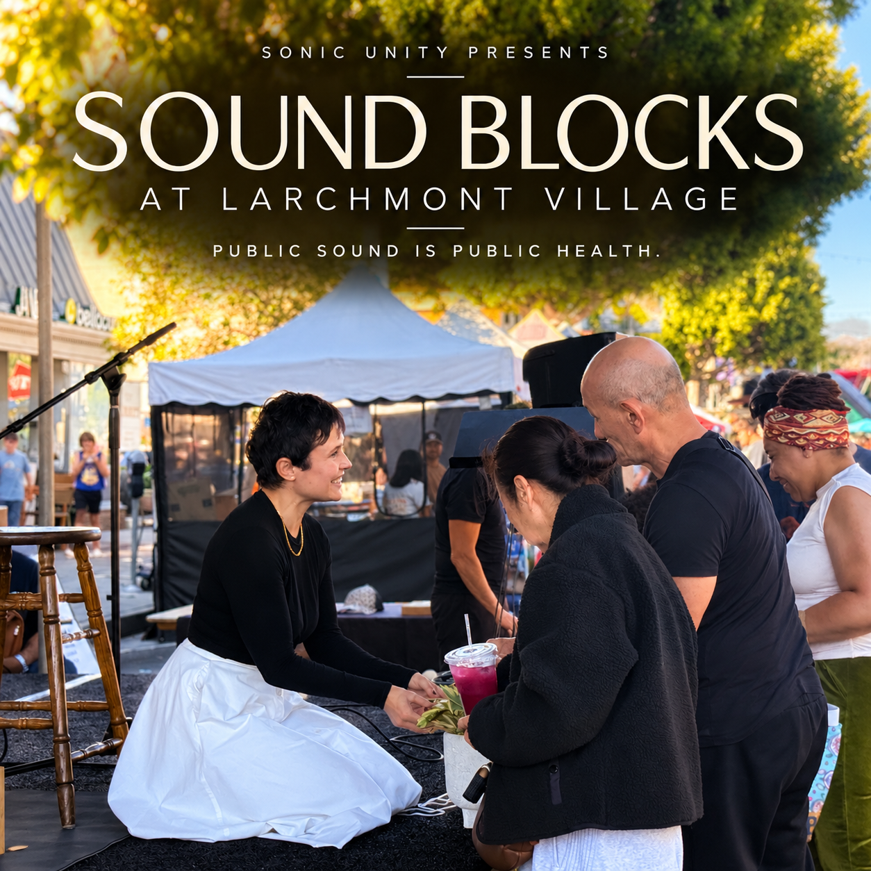 Sandy Duarte on stage leading a sound bath with Sonic Unity’s Sound Blocks initiative at Larchmont Village in Los Angeles, bringing accessible sound healing into public spaces.