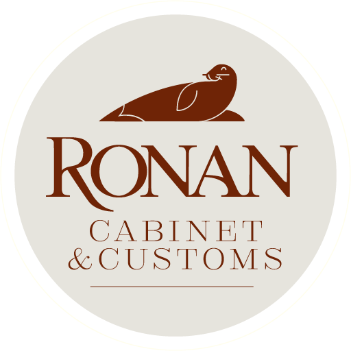 Logo for Ronan Cabinet & Customs featuring a stylized brown bird above the company name.