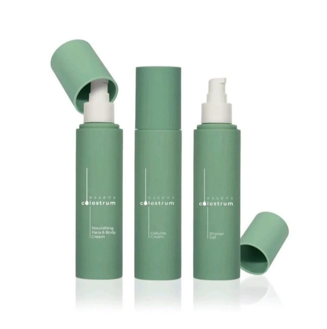 Three green skincare bottles with white pump dispensers, two with caps off revealing pump heads, on a white background.