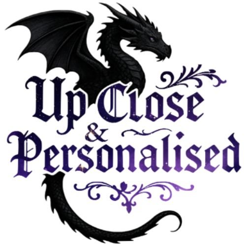 A black dragon with wings and a curved tail above the text 'Up Close & Personalised' written in a decorative purple font.