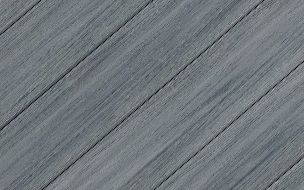 Close-up of a gray Eucalyptus composite deck boards surface with diagonal planks.