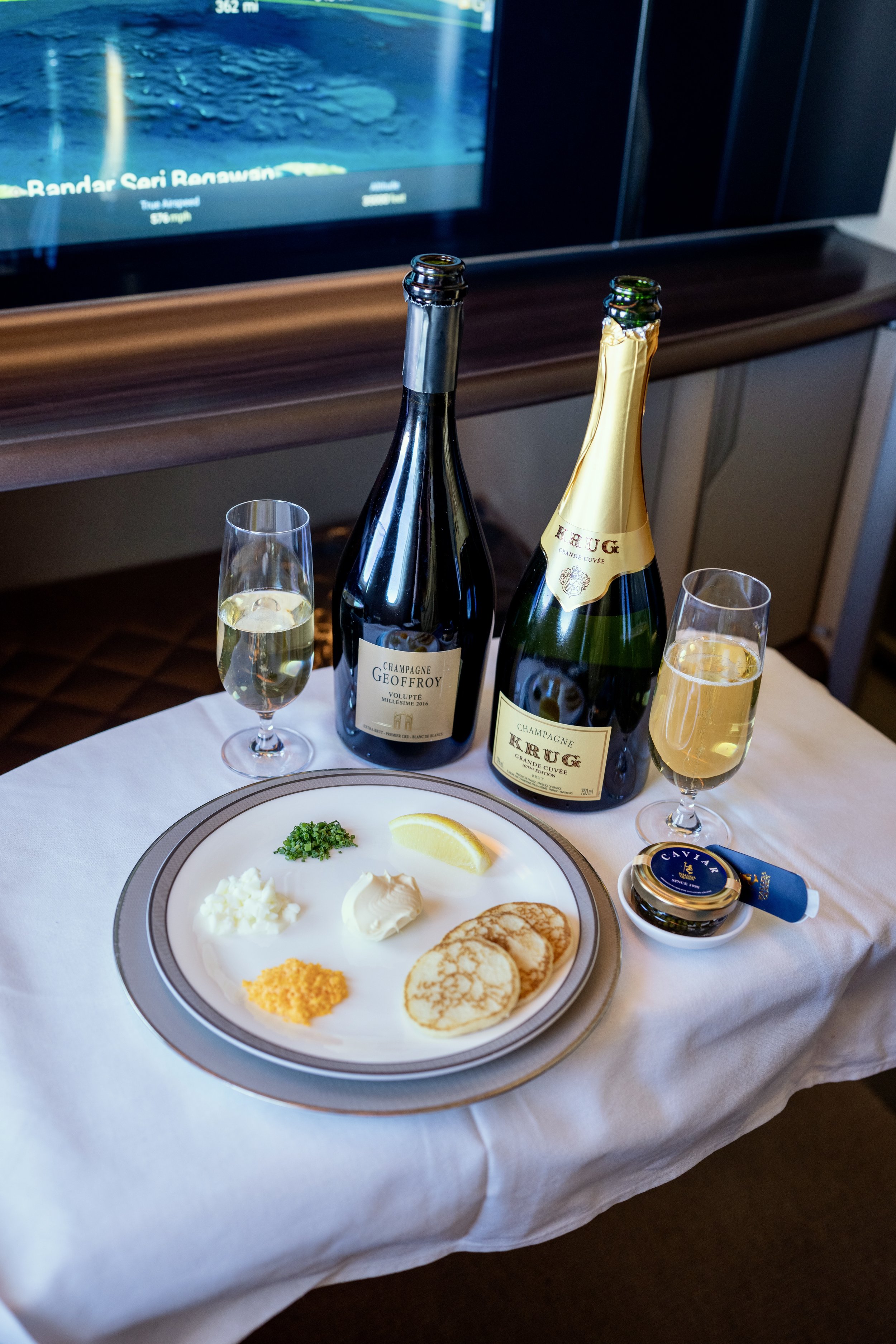 Enjoy caviar and champagne in first class