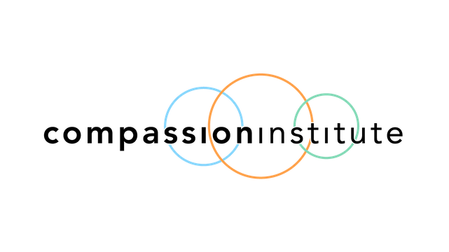 Neon light logo of the word Google with overlapping circles in blue, orange, and green.